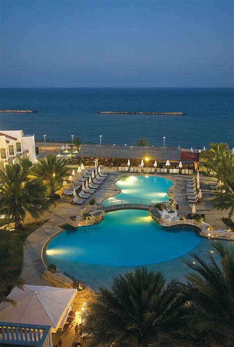 Princess Beach Hotel in Larnaca, Cyprus at dusk | Cyprus hotels, Beach ...