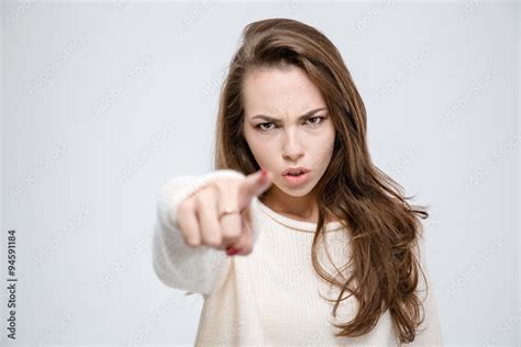 Angry woman pointing finger at camera Stock Photo | Adobe Stock