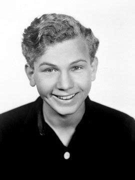 a black and white photo of a woman smiling