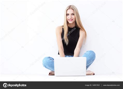 Woman sitting with laptop Stock Photo by ©MaxFrost 145917631