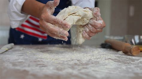 Kneading dough with hands 16090063 Stock Video at Vecteezy