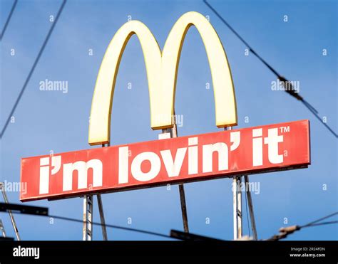 McDonald's logo sign and I'm Lovin' It slogan unusual view as seen ...