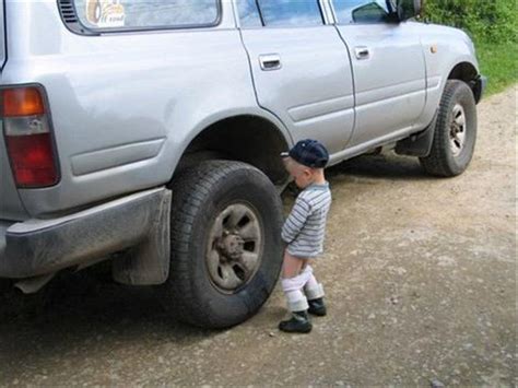 1 boy is peeing on a car - Dump A Day