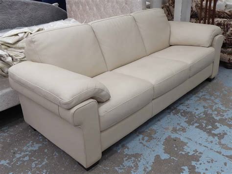 NATUZZI SOFA, three seater, cream leather, 230cm W x 92cm D.