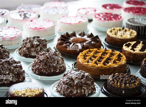 Many cakes on the table. Industrial Cake Line Stock Photo - Alamy