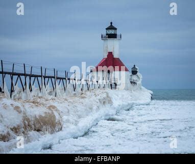 Ice covered St. Joseph pier light in winter. St. Joseph Michigan. On ...