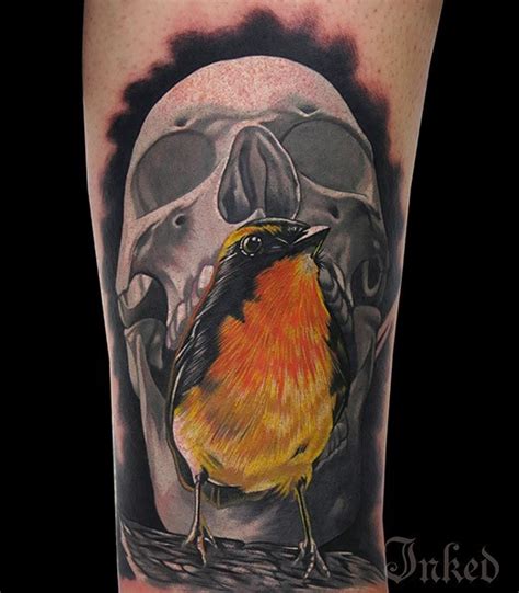 Gray skull with yellow bird tattoo - Tattooimages.biz