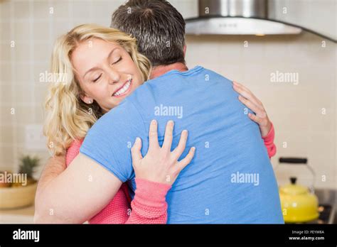 Happy couple hugging Stock Photo - Alamy