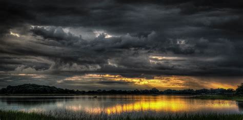 photo of watery field during golden hour Stormy weather #photo #watery ...