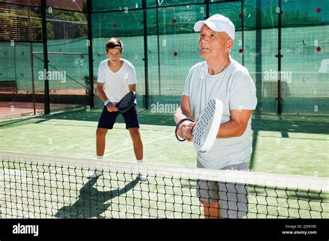 padel players of different generations playing padel court Stock Photo ...