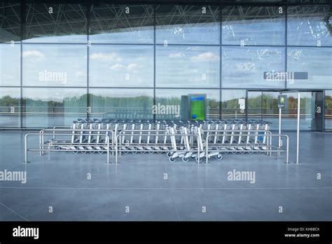 ZAGREB AIRPORT - 24 APRIL 2017: Trolley stand at the entrance of the ...