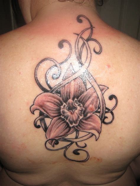 Pink orchid and patterns tattoo on back - Tattooimages.biz