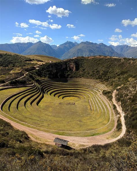 an aerial view of a large circular structure in the middle of a grassy ...