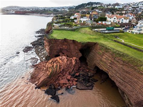 Dramatic pictures show huge chunk of rock lying in the sea after cliff ...