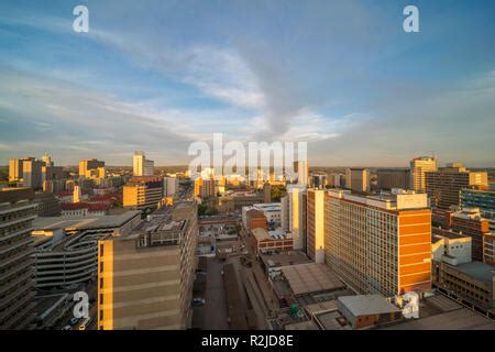 A sunset is seen over the Harare city skyline in Zimbabwe Stock Photo ...