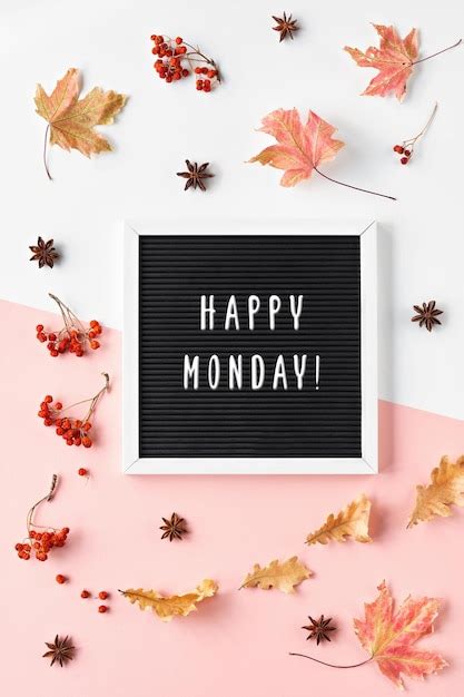 Premium Photo | Happy monday greeting text on text board autumn leaves ...