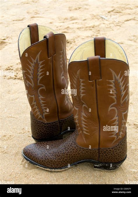 Leather Cowboy style boots, complete with engraving Stock Photo - Alamy