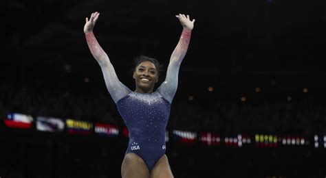 Simone Biles leads U.S. women to seventh straight title at world ...