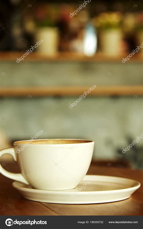 Coffee cup in coffee shop interior Stock Photo by ©pongans68@gmail.com ...