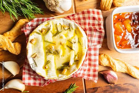 Oven Baked Camembert with Garlic,Rosemary and Chutney Stock Photo ...