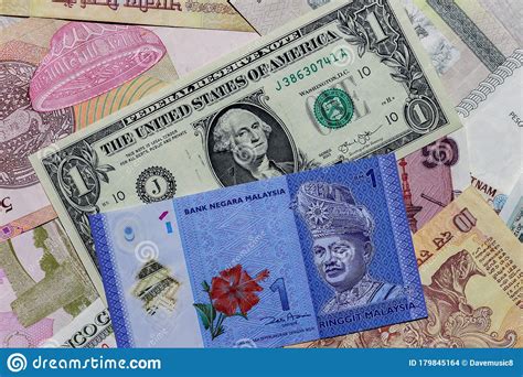 One US Dollar with Different Malaysian Ringgit Banknotes Stock Photo ...