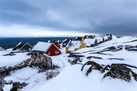 Premium Photo | Frozen inuit houses covered in snow nuuk greenland