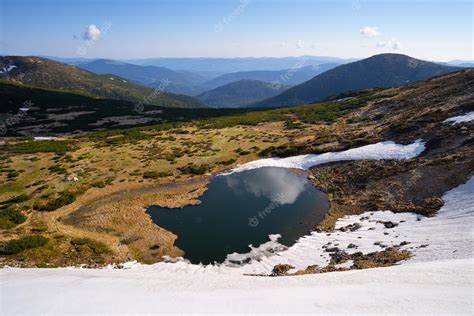 Premium Photo | Spring landscape with a mountain lake