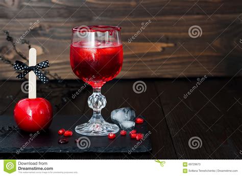 Spooky Bloody Cocktail and Red Caramel Apple. Traditional Dessert and ...