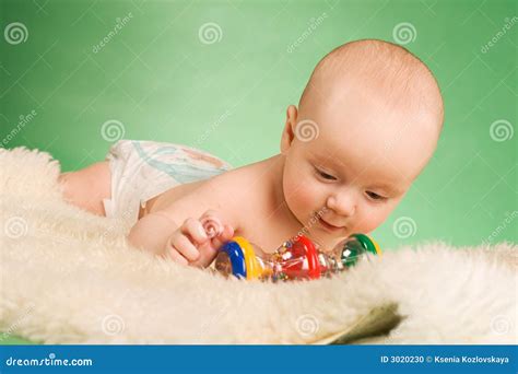 Happy baby playing stock photo. Image of lying, babies - 3020230