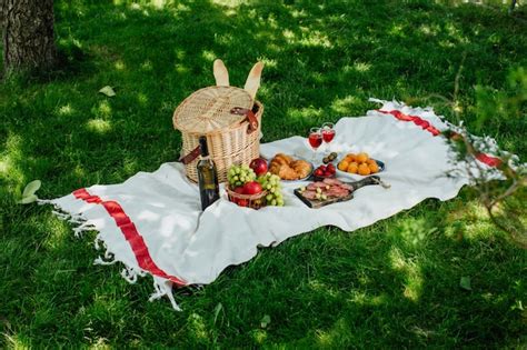 Premium Photo | Picnic in the park on green grass