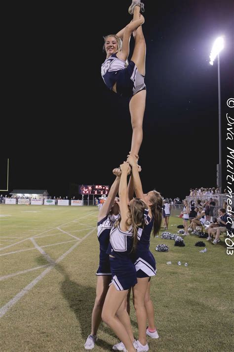 the cheerleaders are doing tricks on the field