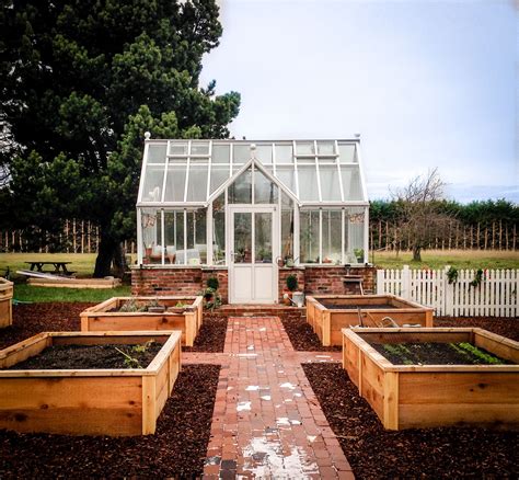 Adorable 8x12 custom greenhouse with vestibule is the perfect anchor ...