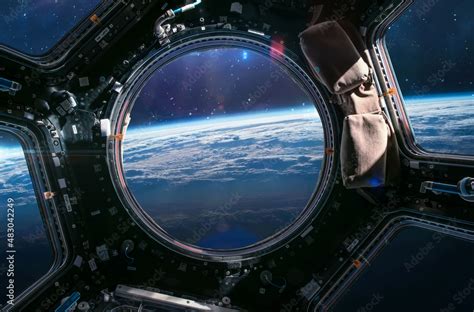 Earth planet in ISS porthole. View from Cupola. International space ...