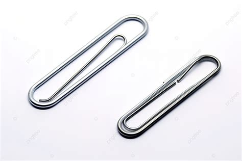 A Collection Of Three Paper Clip Shapes Laying On A White Surface ...