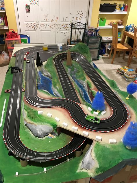 Carrera Go 1/43 slot car layout on 8x4 table. Trees and pylons are ...