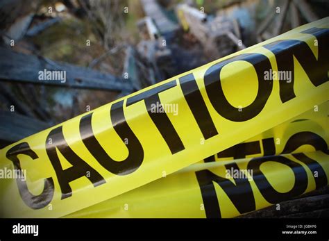 Caution tape bordering a crime scene Stock Photo - Alamy