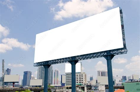 large blank billboard on road with city view background Stock Photo ...