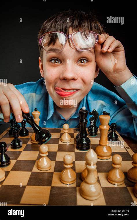 Wunderkind play chess. Funny Nerd boy Stock Photo - Alamy