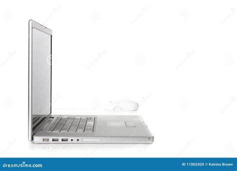 Sideways View of a Laptop Computer and Mouse Stock Photo - Image of ...