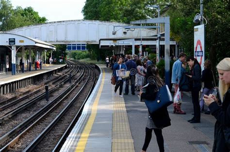 Passengers Wait At District Line Platform Of Kew Gardens Tube Station ...