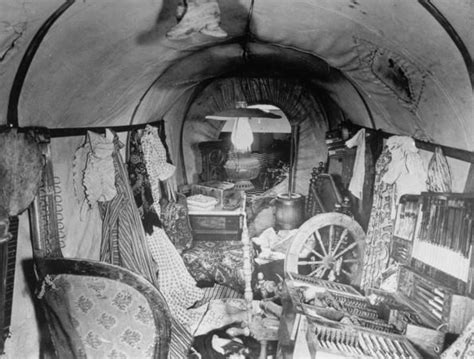 Interior of prairie schooner crammed w. clothes, furniture & other ...