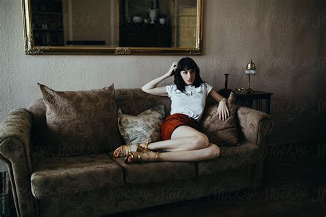 "Fashionable Woman Sitting On Sofa" by Stocksy Contributor "Jovana ...