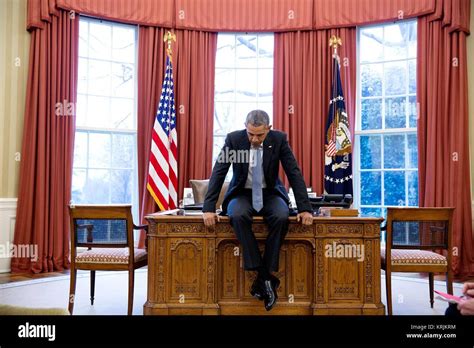 Collectables President Barack Obama tries out desk chairs in the Oval ...