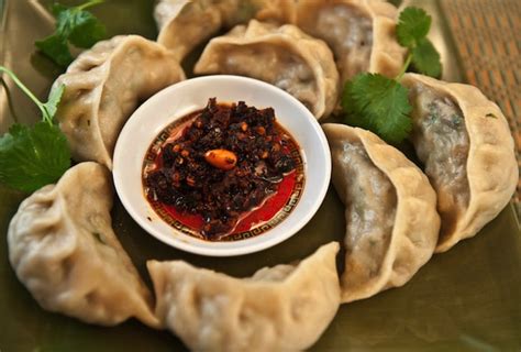 Nuns making Tibetan momos with video - Tibetan Nuns Project