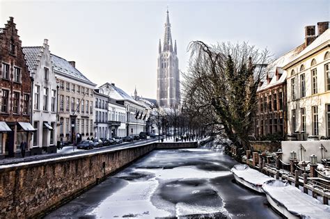 Winter time in Bruges. It was so cold the canals were frozen but the ...