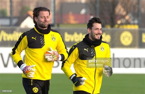 Borussia Dortmund goalkeepers Roman Weidenfeller and Roman Burki run ...