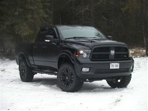 Black Dodge Ram 1500 Truck in Snow