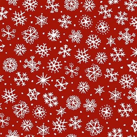 White snowflakes falling on a bright red background