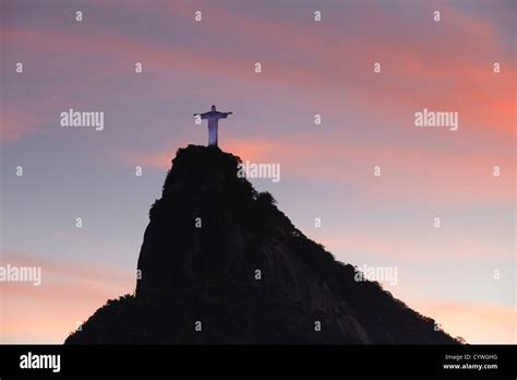 Christ the Redeemer statue (Cristo Redentor) at sunset, Corvocado, Rio ...