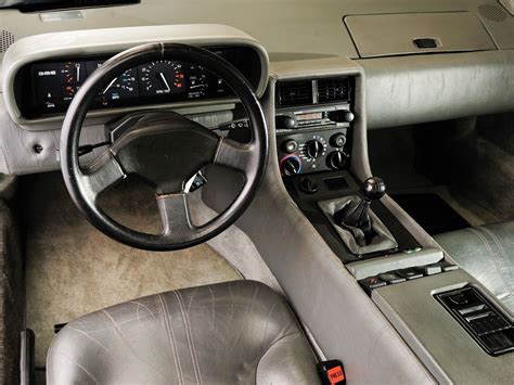 an interior view of a car with the steering wheel and dash board ...